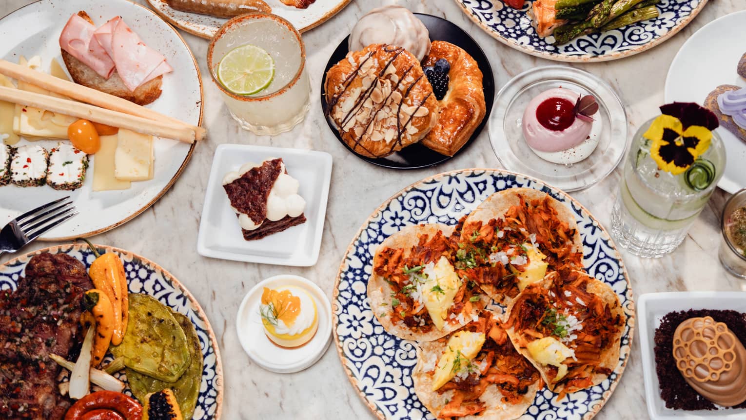 A colourful array of brunch dishes set out on a table
