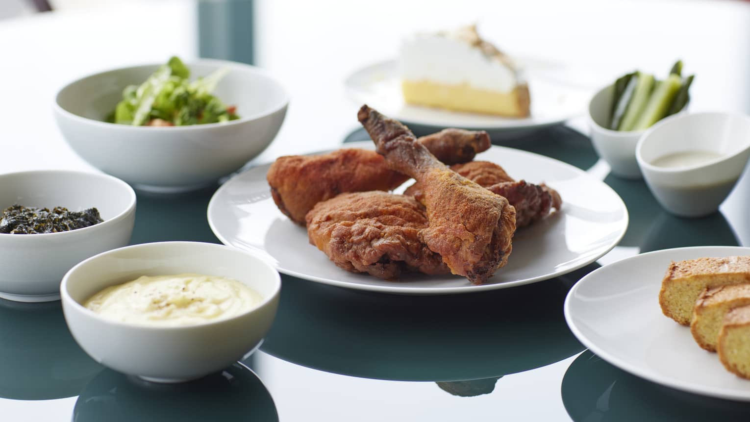 Marunouchi Fried Chicken with Cobb Salad & Kale Dressing, Braised Kale, Mashed Potatoes, Cornbread, House-made Pickles, Ranch Dressing and Lemon Meringue Pie