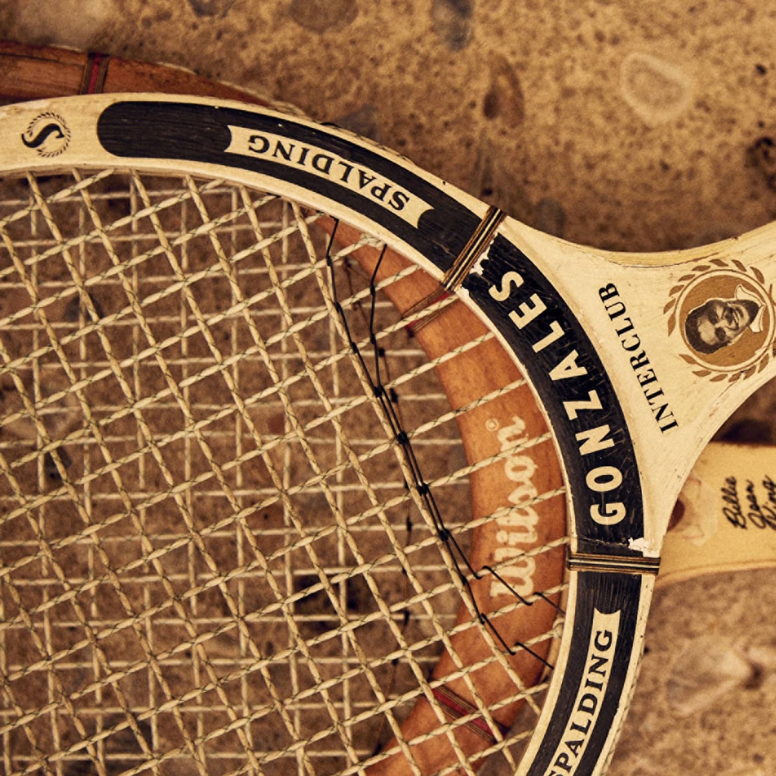 Two tennis racks made of wood.