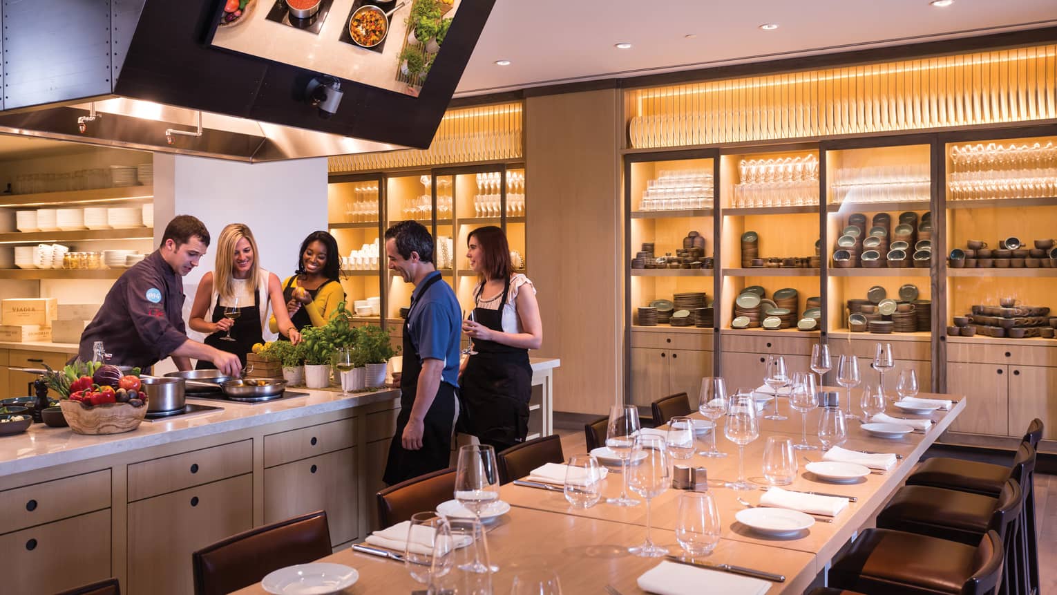 A four seasons chef demonstrates to guests how to cook in Ravello's kitchen 