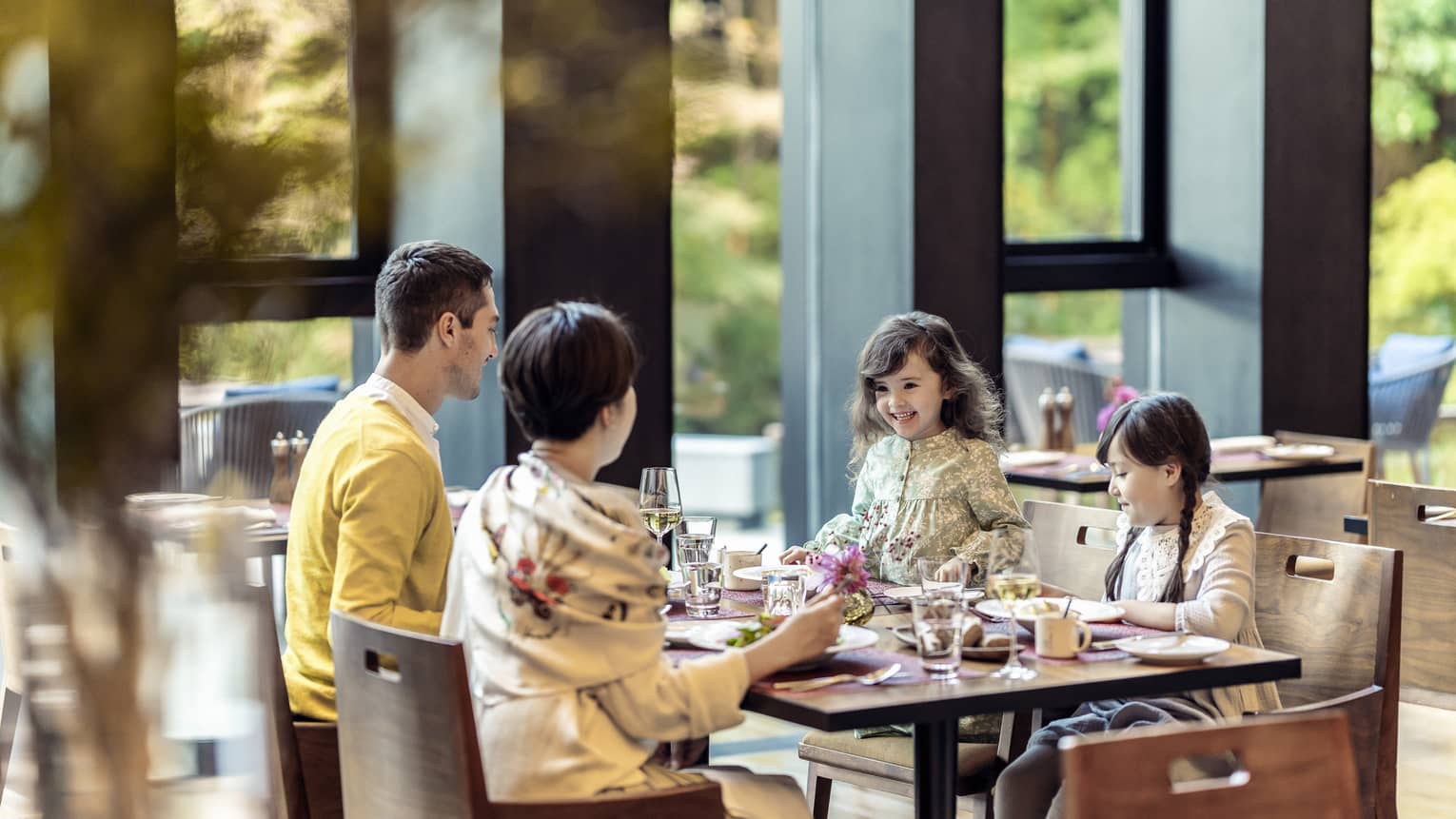 Parents and two young daughters share a meal at Brasserie