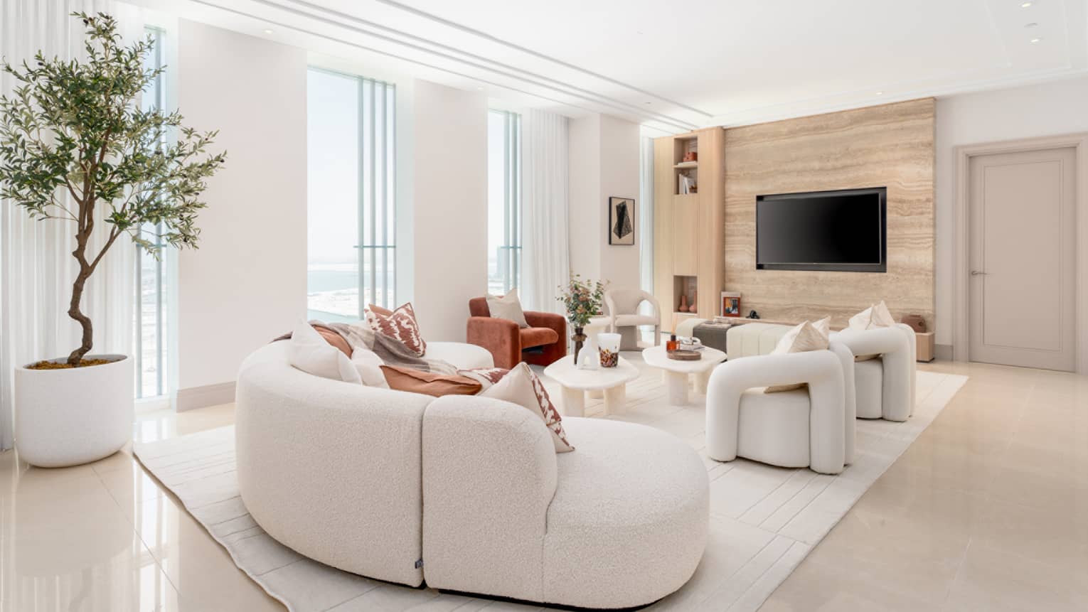 Living room interior of residence with floor-to-ceiling windows