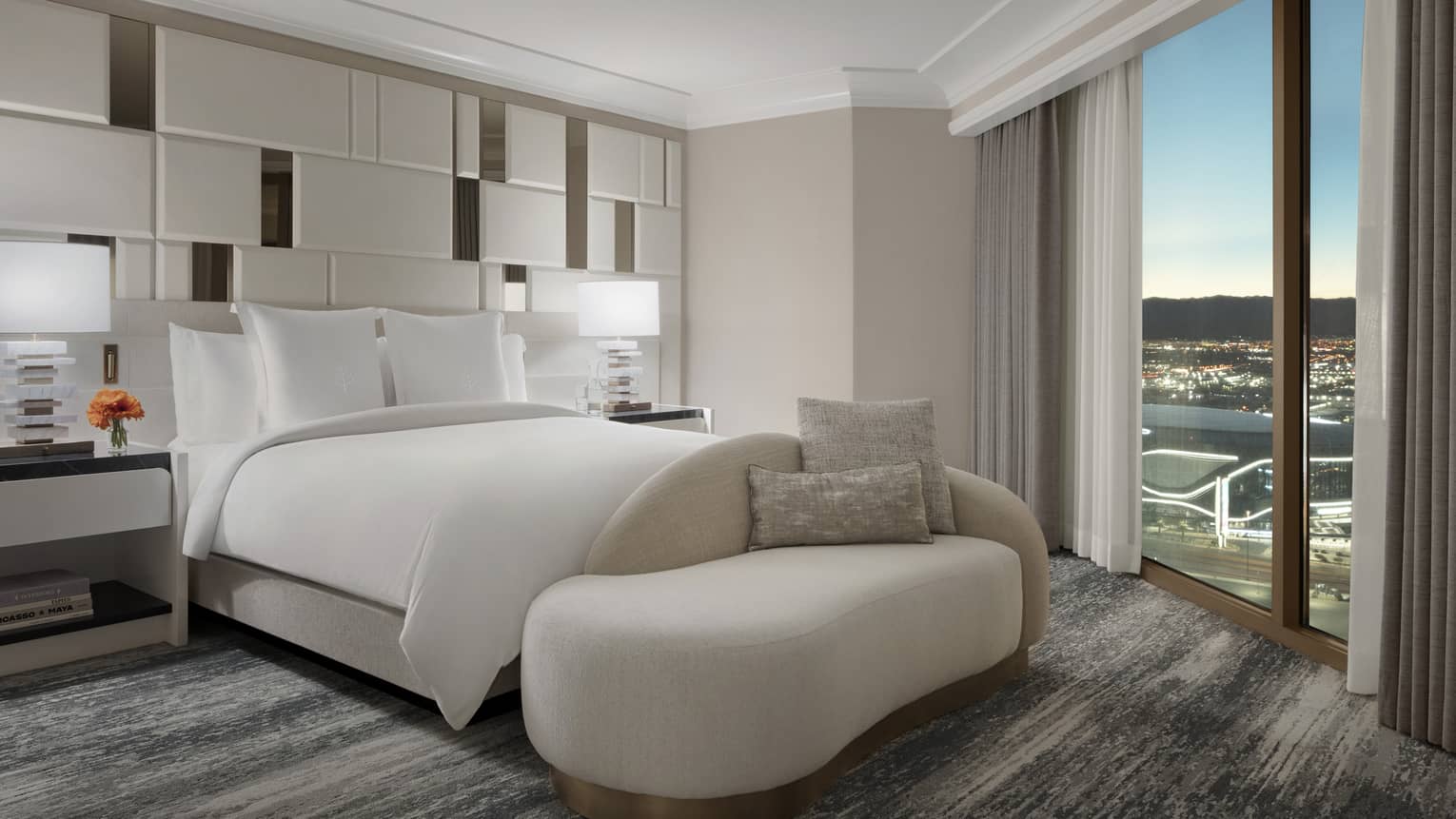 Bedroom with king bed and curved chaise, wall of windows looking out to Las Vegas Strip, Presidential Suite at Four Seasons Hotel Las Vegas