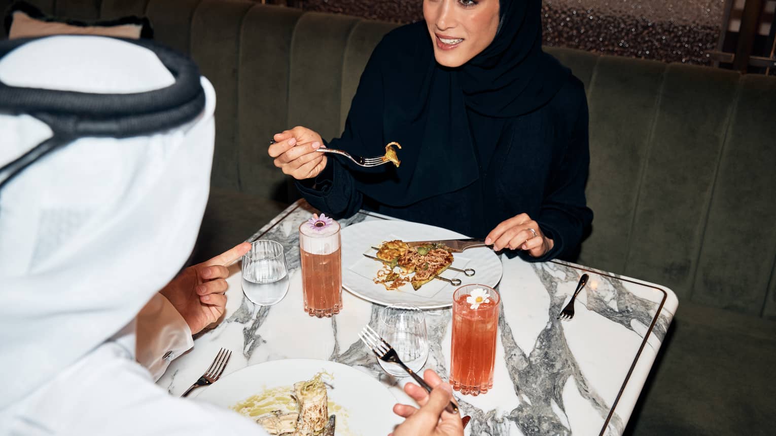 Man and woman dine at marble table