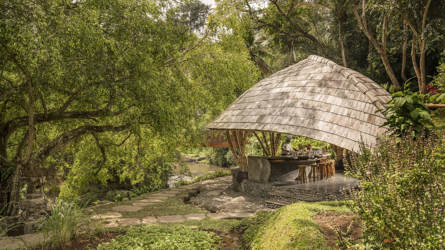 Four Seasons guests attend Sokasi Cooking School in an outdoor pavillion
