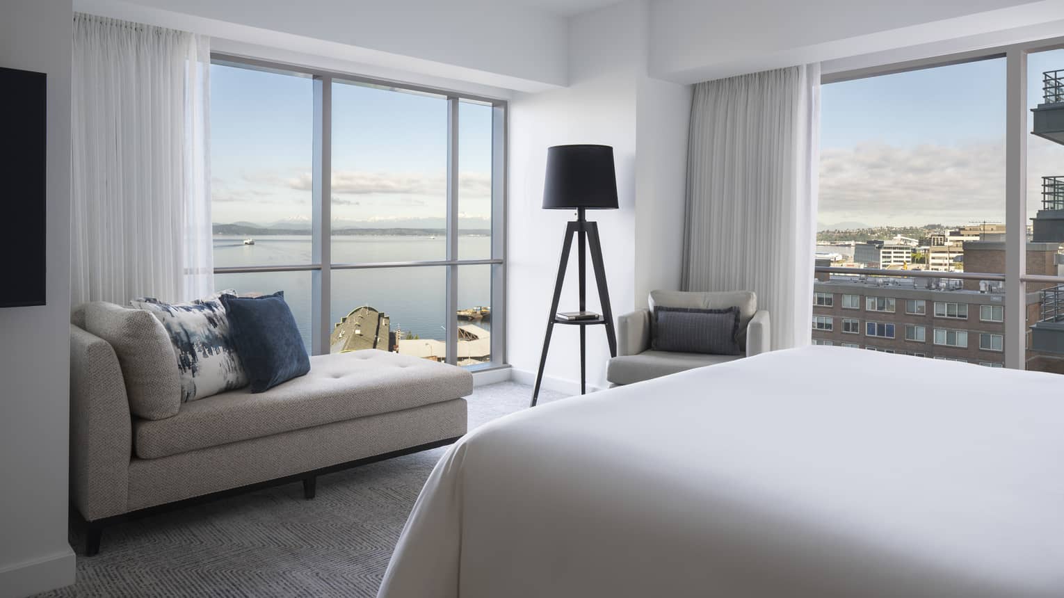 The well-lit Bay Suite overlooks boats sailing along Elliot Bay