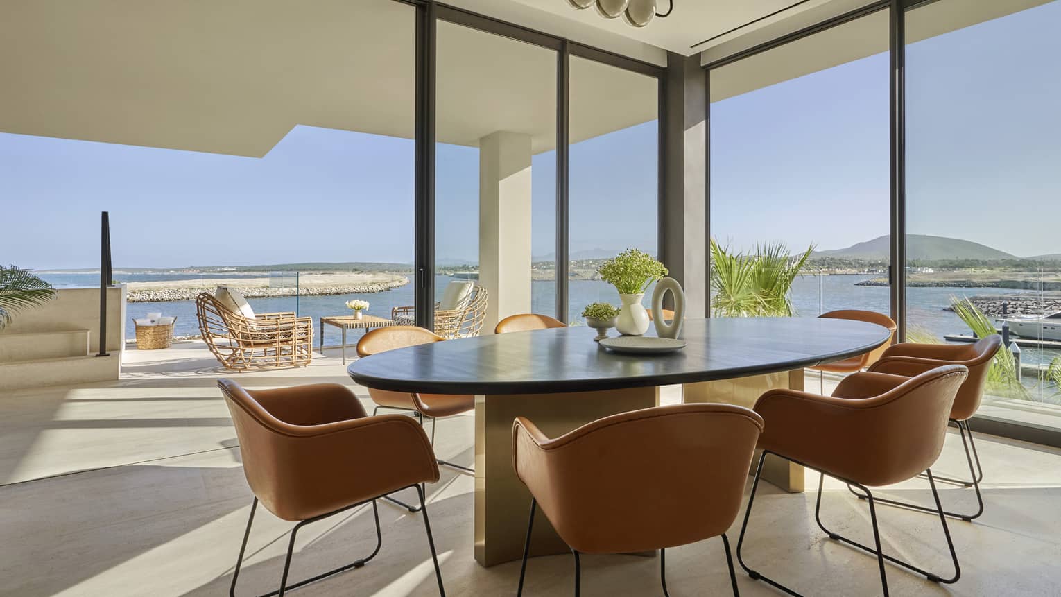 Ocean-View residence dining room with floor-to-ceiling windows and ocean view