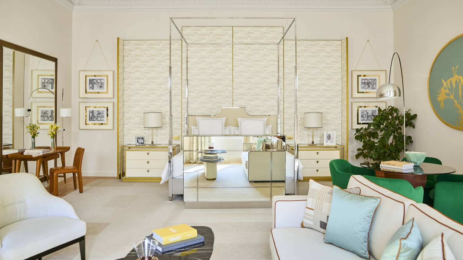 Modern luxury hotel suite with metal four-post bed, dining table with four green chairs, and a sitting area with a white sofa and arm chair