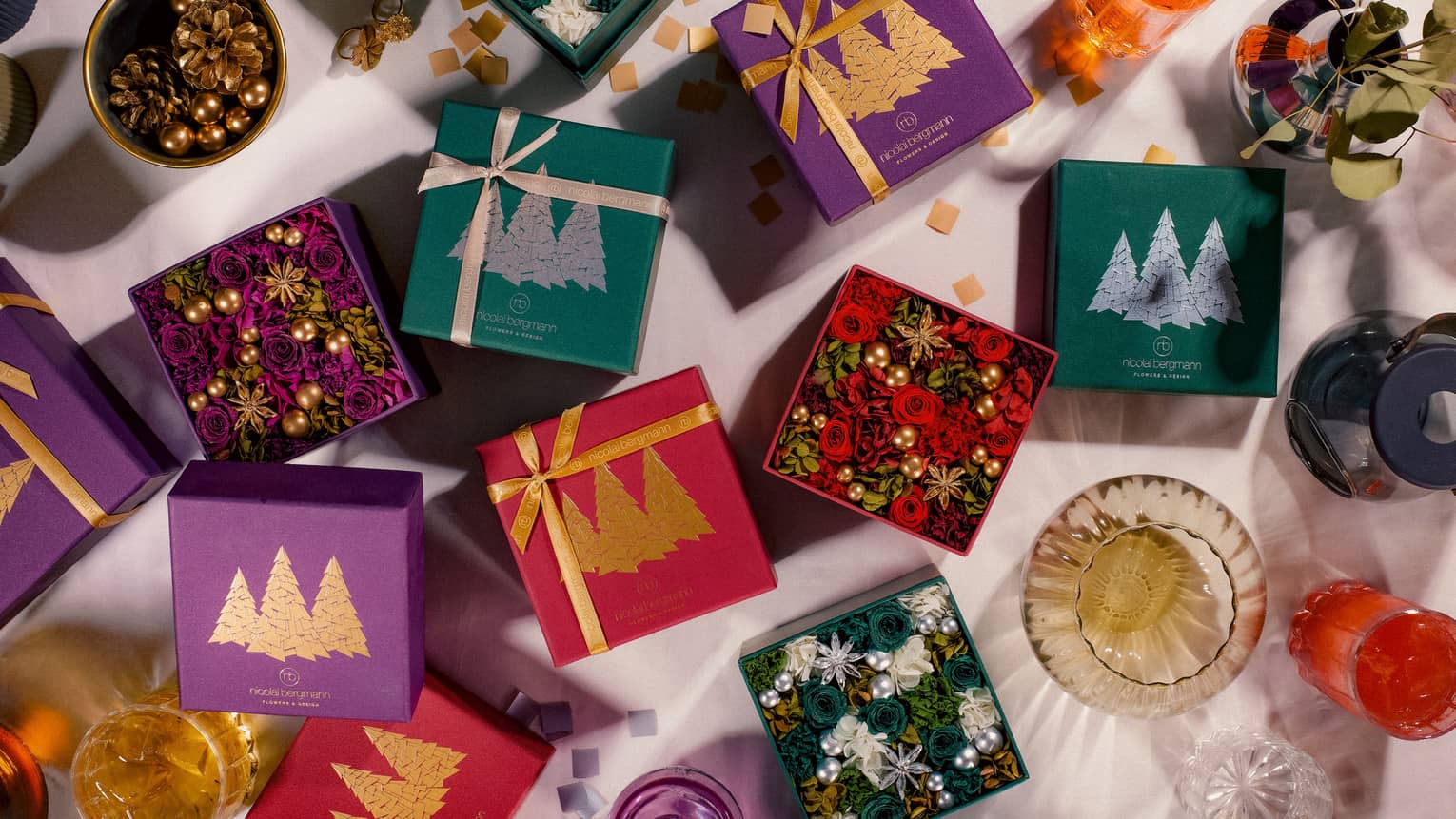 Christmas wrapped gift boxes with nordic tree decoration that contain preserved flowers. Nicolai Bergmann Flower Box
