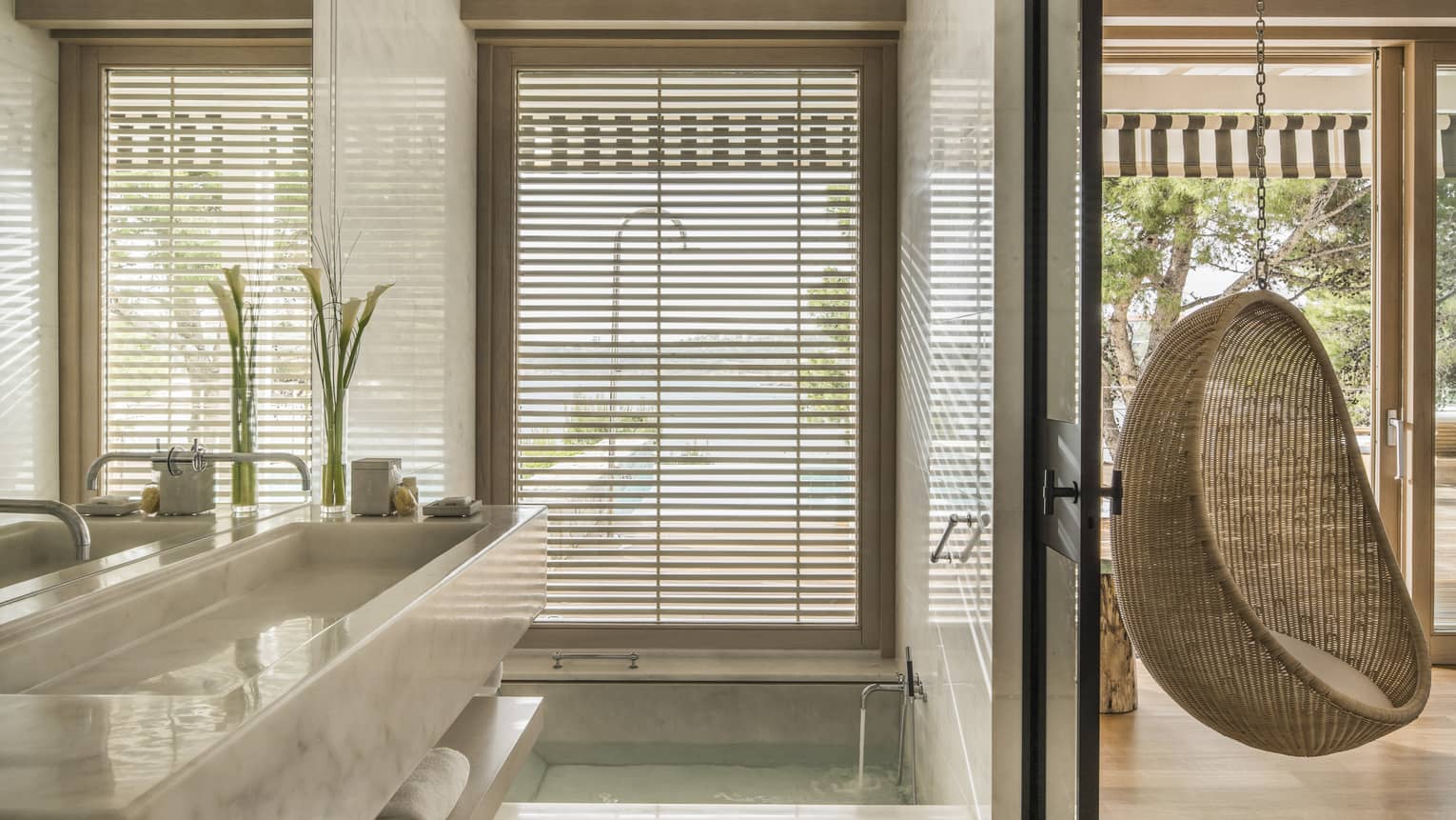 Bungalow Suite with Pool Bathroom, full-width marbled vanity and mirror, hanging rattan egg chair