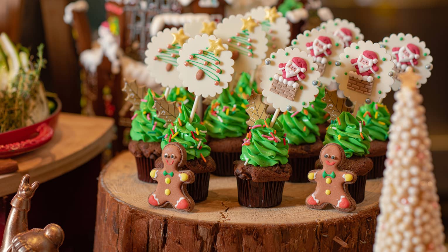 Various Christmas confections lined up on a log