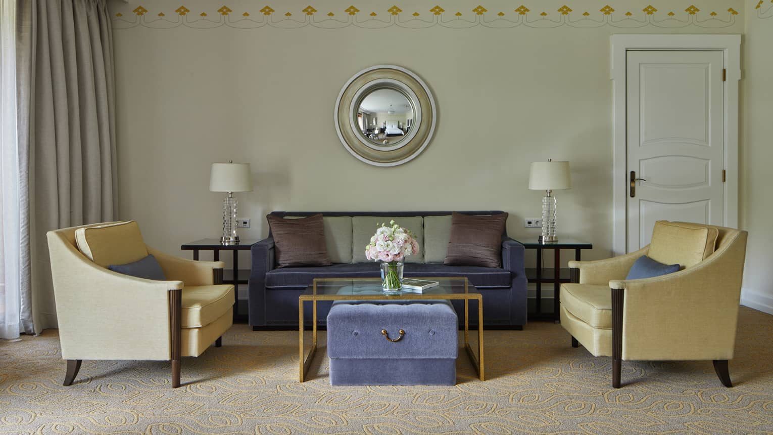 A sofa, two chairs and coffee table.