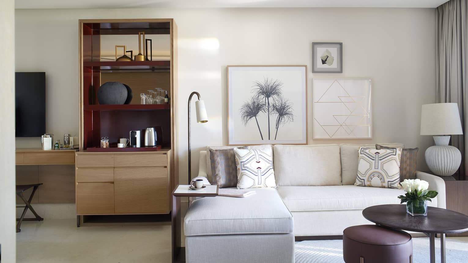 Sitting area with white sofa and wet bar area