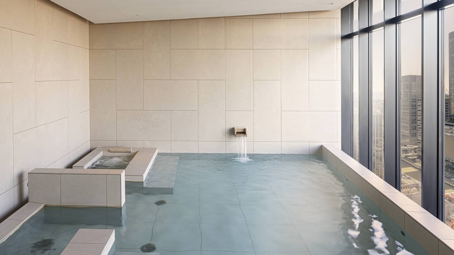 Four Seasons Hotel Osaka Japanese ofuro tub with wall of windows looking out to Osaka city
