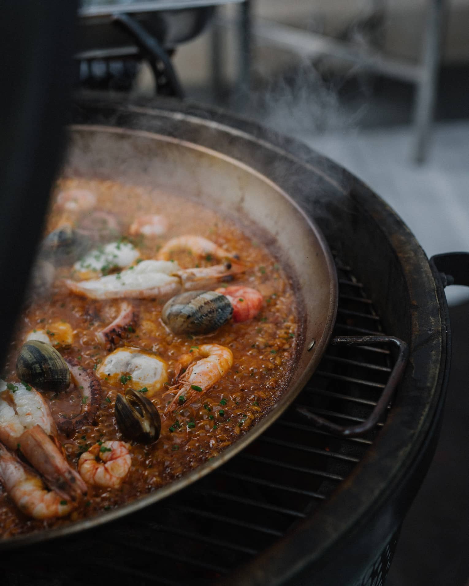 Paella cooking on grill