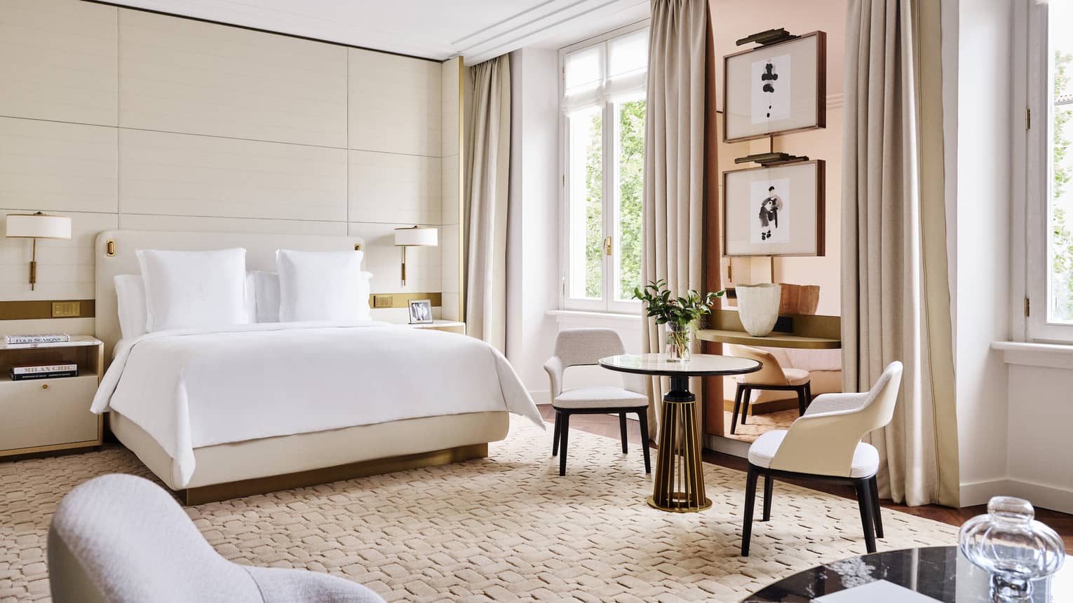 Elegant hotel guest room with king bed and windows