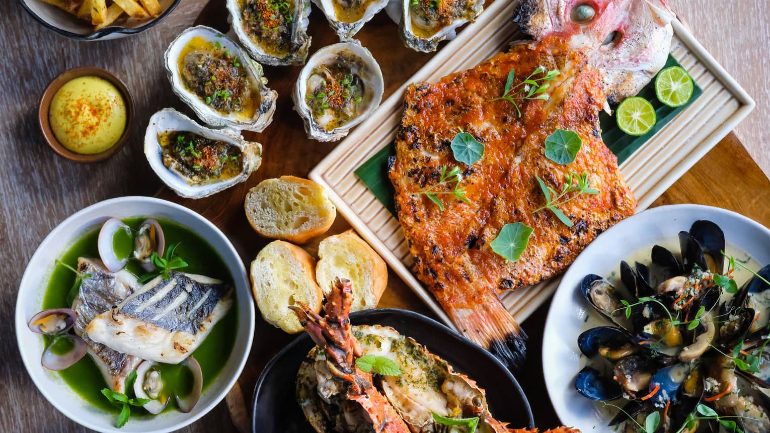 bamboo lobster, tiger prawns, flower crab, Tasmanian salmon, baby snapper, yellowfin tuna, oysters, mussels, clams, squid