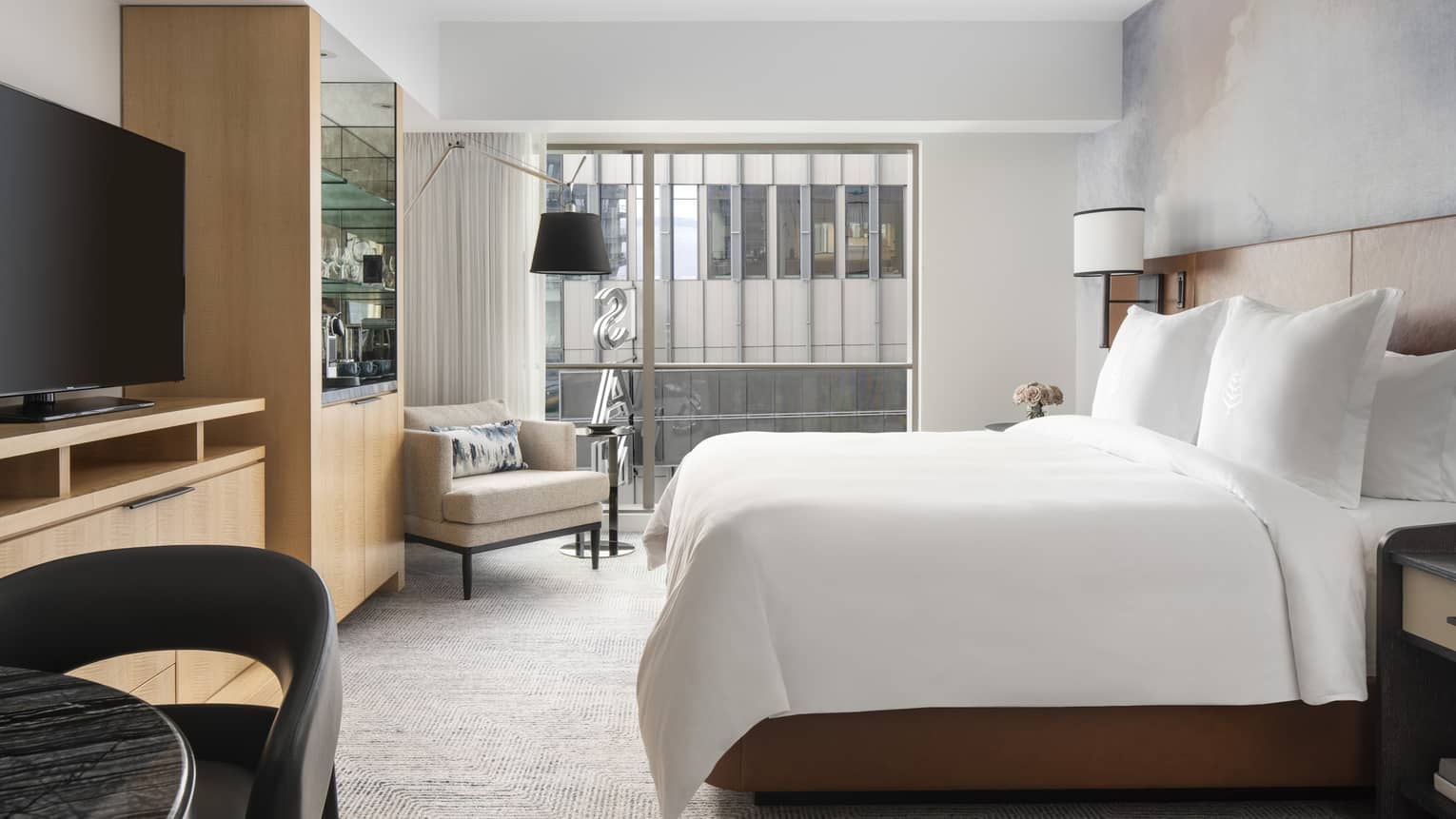Contemporary Seattle-view rooms feature plush king beds and floor-to-ceiling windows