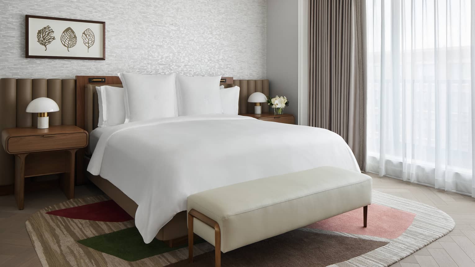 Bedroom with king bed and nature-inspired, contemporary decor at Four Seasons Hotel Washington, DC