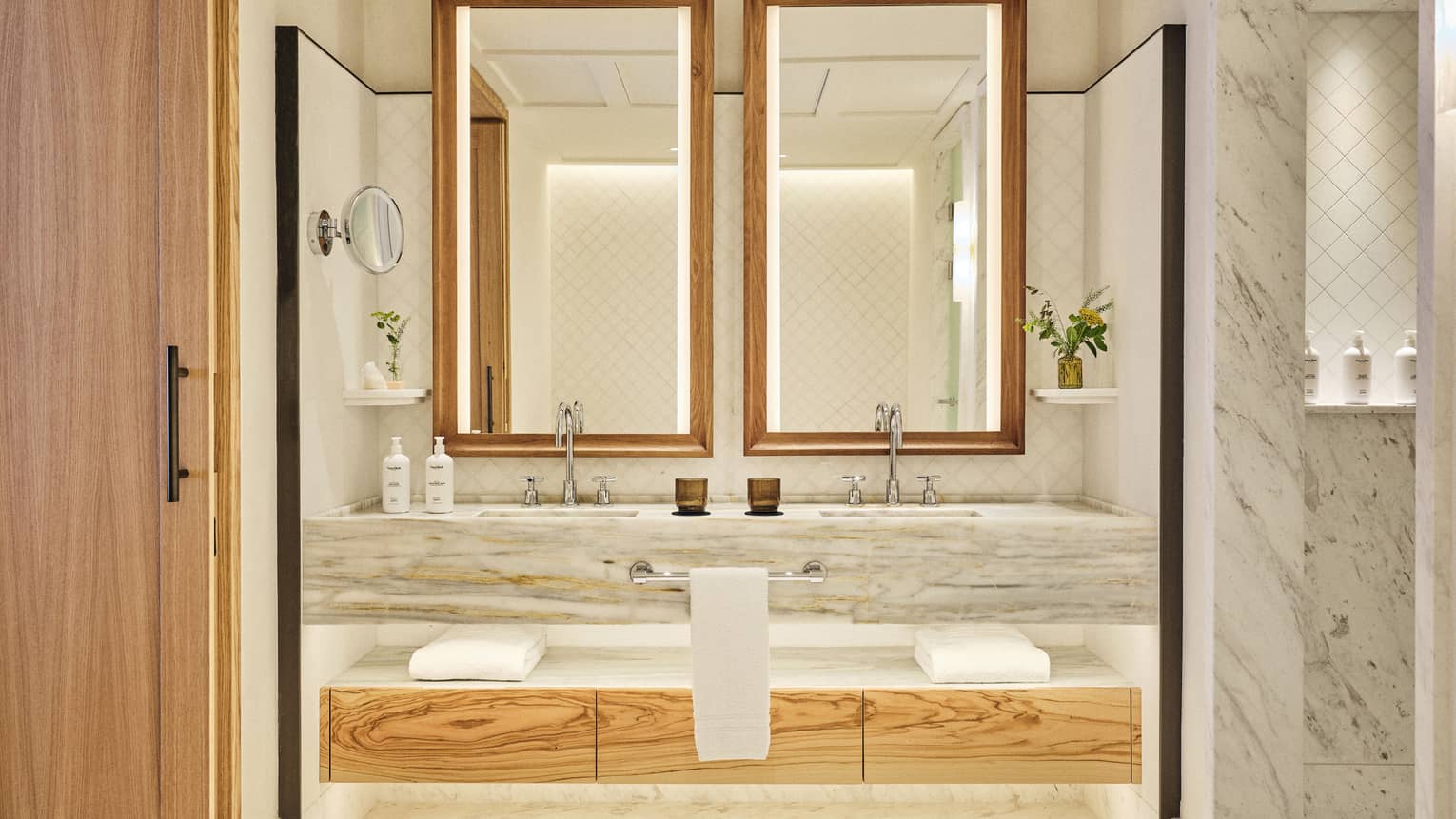 Illuminated marble vanity of luxury suite at Four Seasons Resort Mallorca
