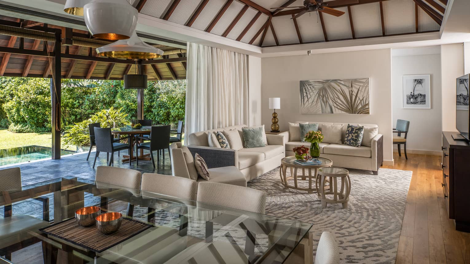 Garden Residence Villa large dining table, modern lights from cathedral ceilings, living room