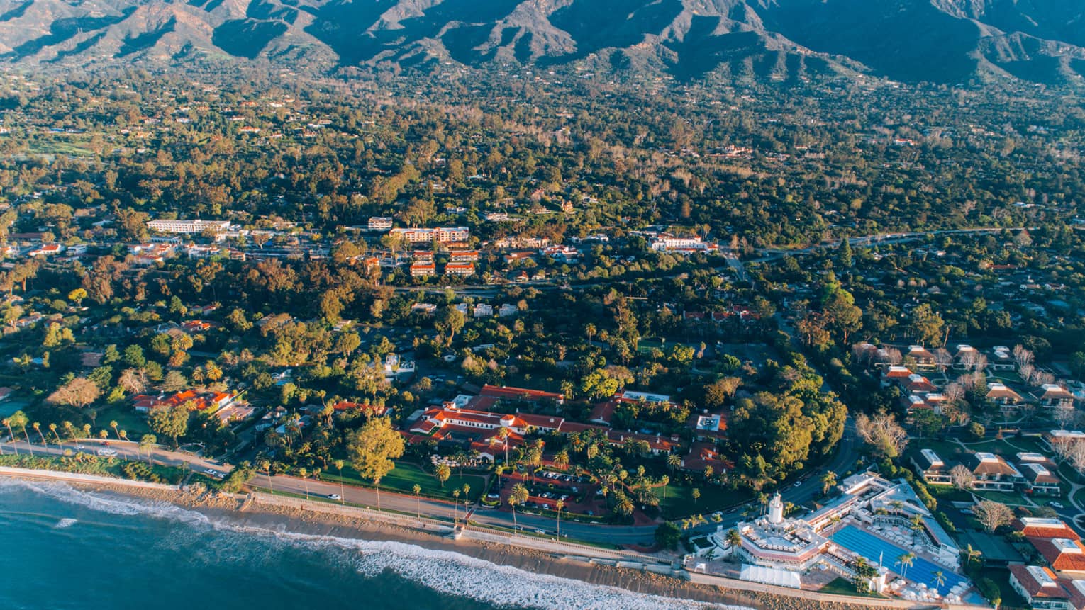 Aerial view of Santa Barbara, California coastline, mountains in distance