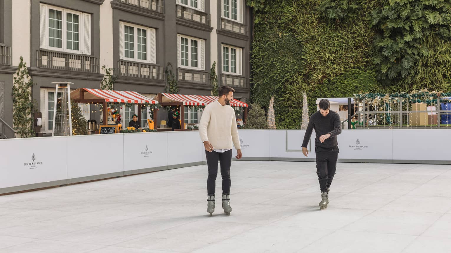 Two men iceskating.