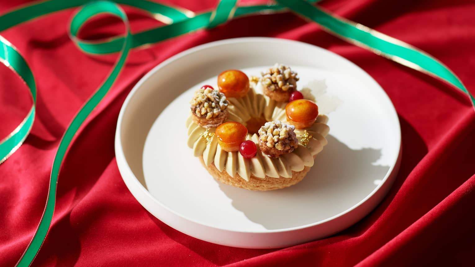 A dessert with pistachios on a white plate.