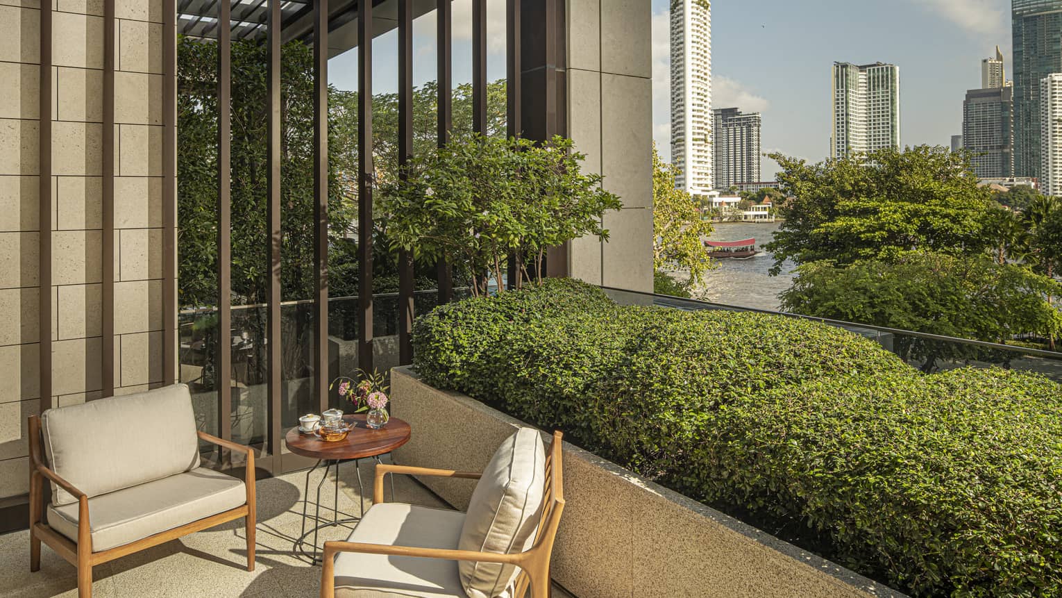 River-view balcony of guest room at Four Seasons Hotel Bangkok