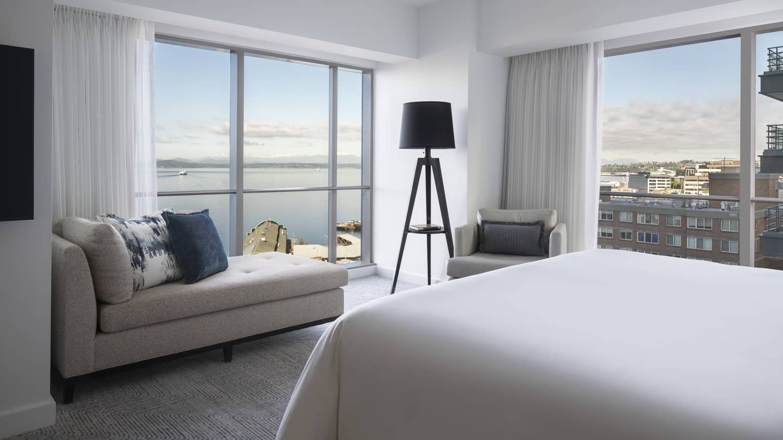 The well-lit Bay Suite overlooks boats sailing along Elliot Bay