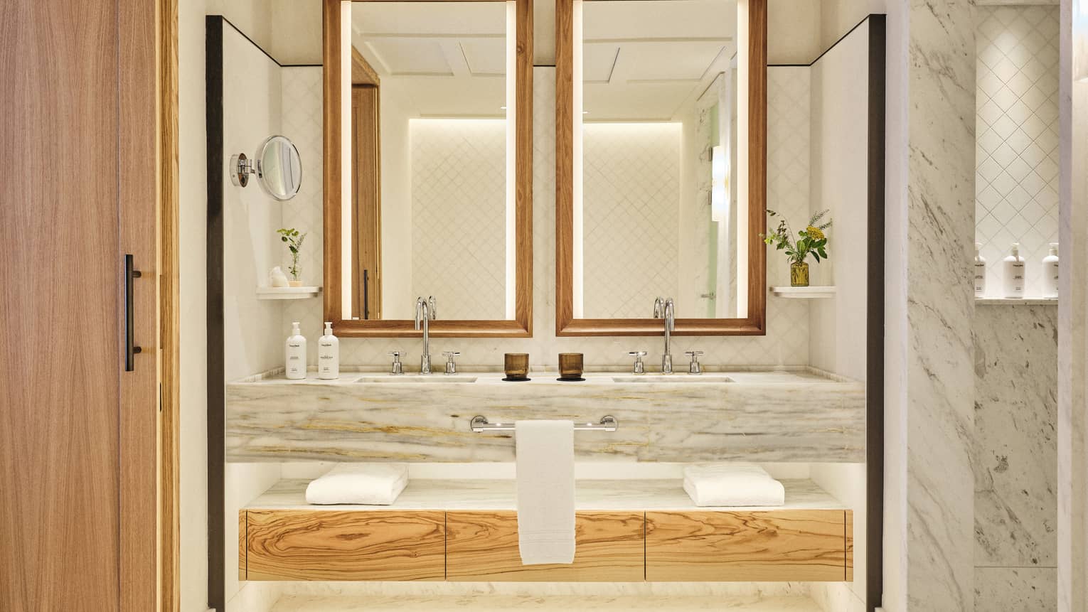 Illuminated marble vanity of luxury suite at Four Seasons Resort Mallorca