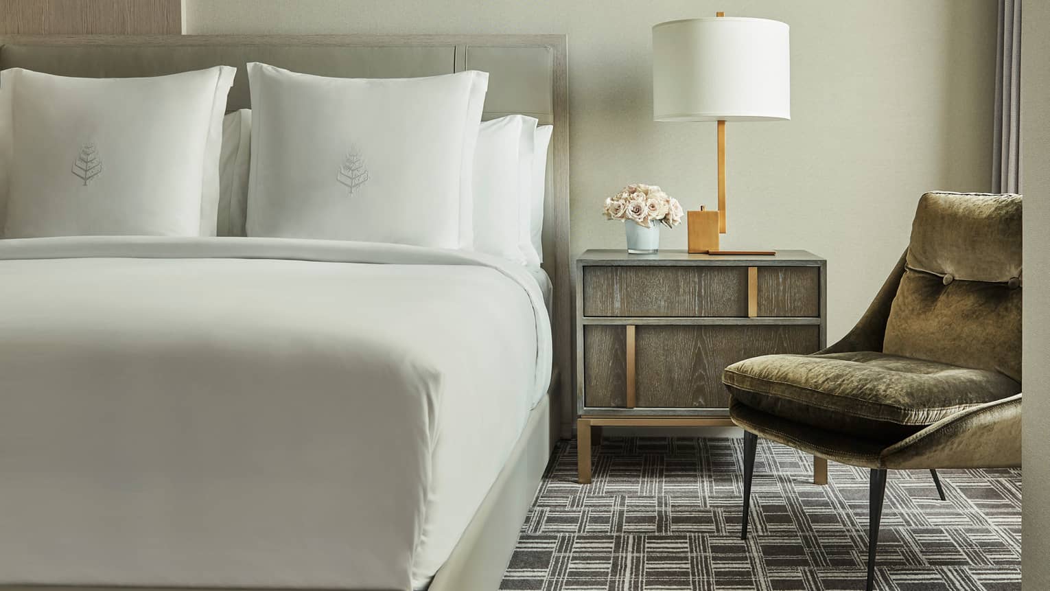 Superior Room bed, nightstand with lamp, mid-century style velvet armchair