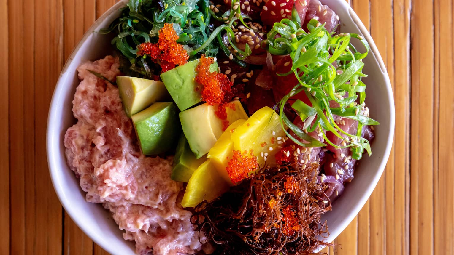 Poke bowl with avocado, mango and ahi tuna