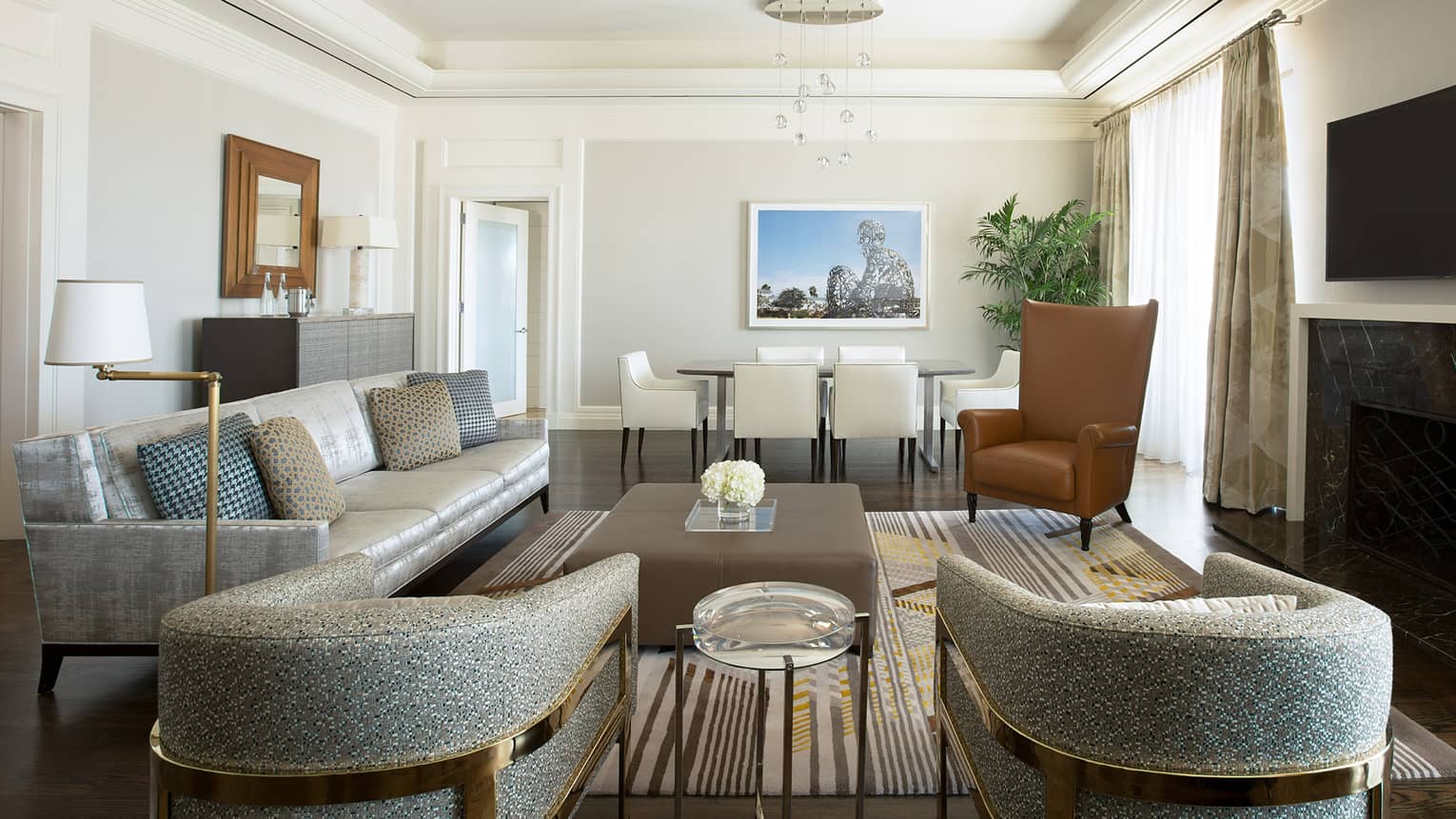 Retro-style grey armchairs, silver leather sofa, leather ottoman table, wingback armchair, dining table