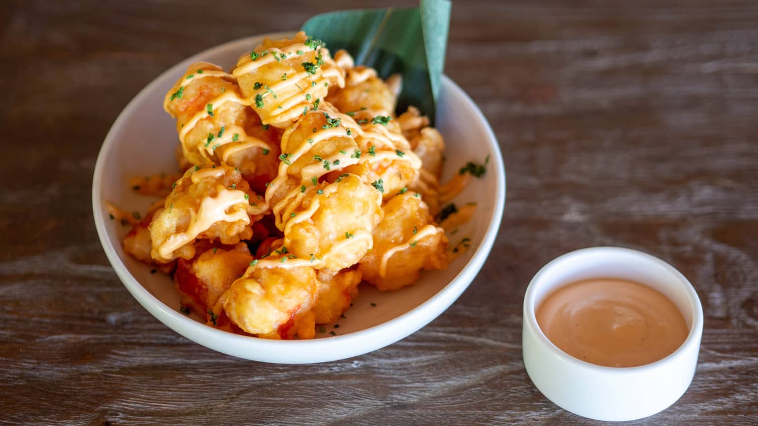 Fried shrimp with an orange sauce.