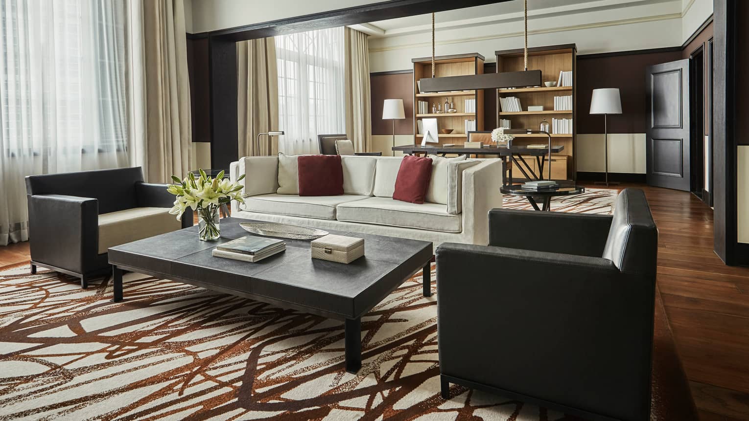 Bright Governor Suite sofa and two armchairs by coffee table, brown-and-white rug