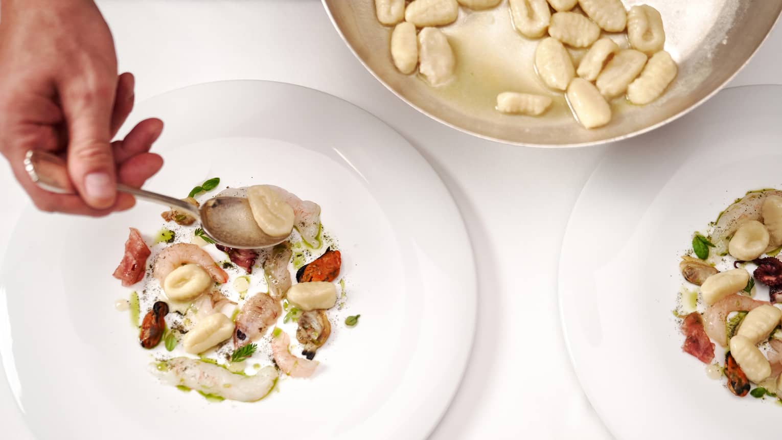Gnocchi with raw seafood.