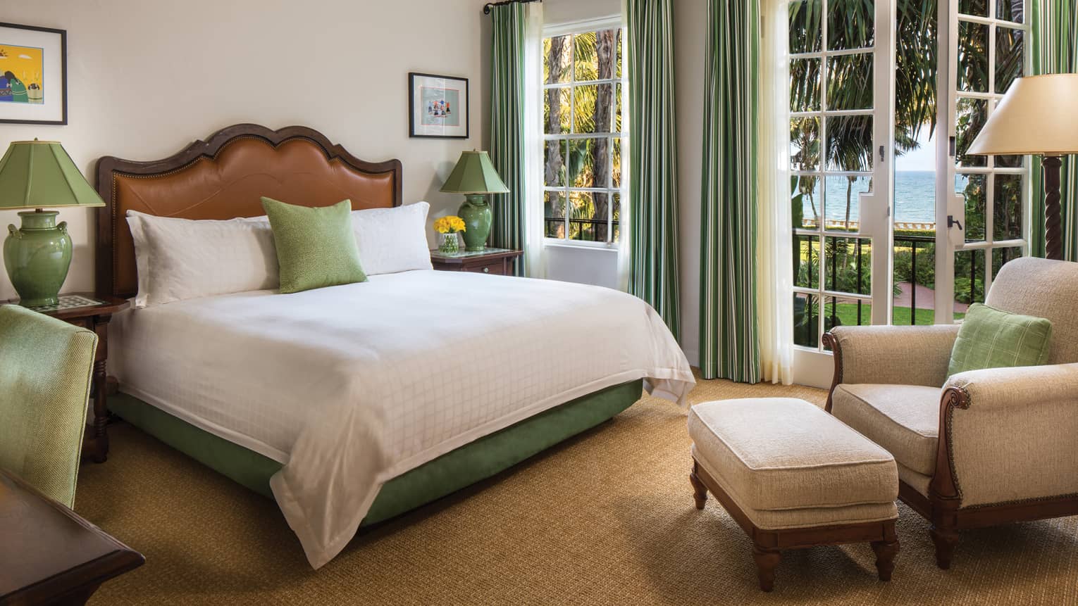 Mariposa Suite bed, armchair and ottoman by open French patio doors 