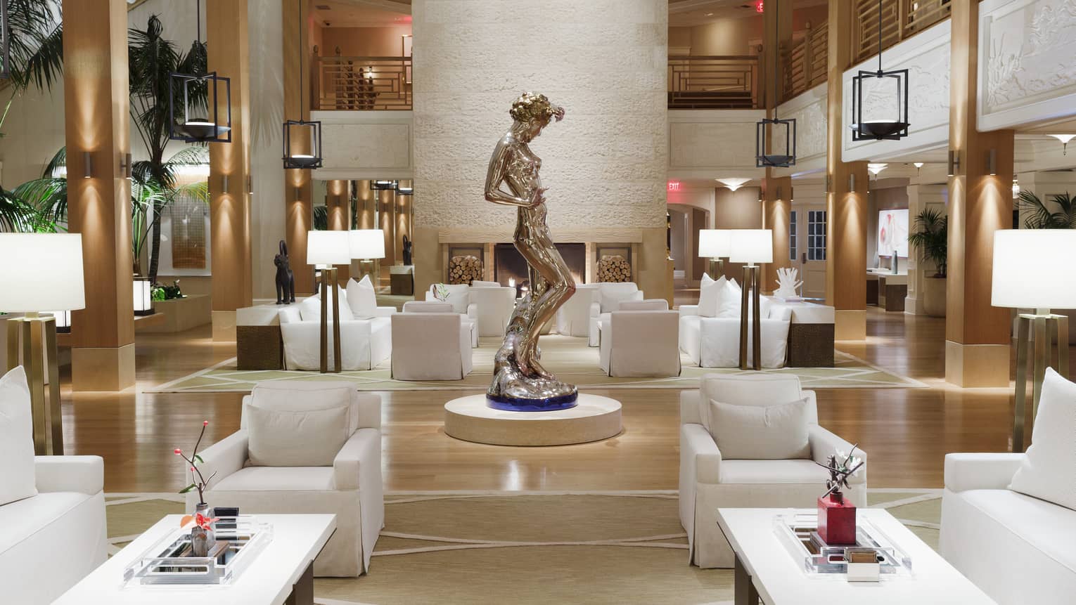 A sculpture of a woman stands in the middle of Sensei Lanai, A Four Seasons Resort lobby