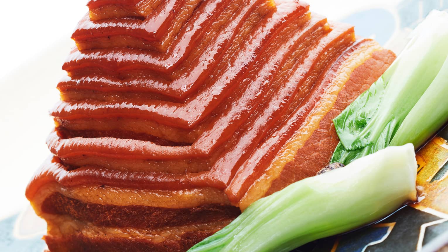 Dongpo-Style Braised Pork Belly simmered in Chinese spices and steamed for 3 hours with stuffed bamboo shoot and pork fat