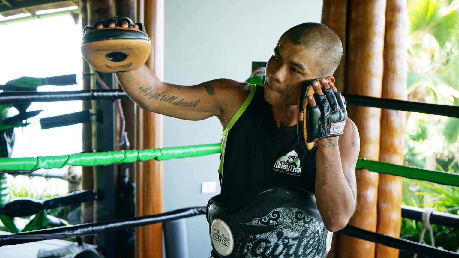 Resident Muay Thai expert, Anuphong Deesamer, leading a sparring session