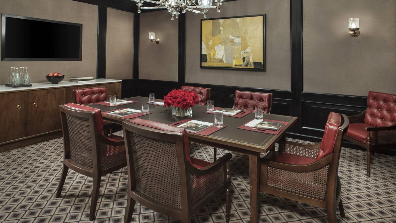 Margot Meeting Room with small boardroom table for six with tufted red leather chairs 