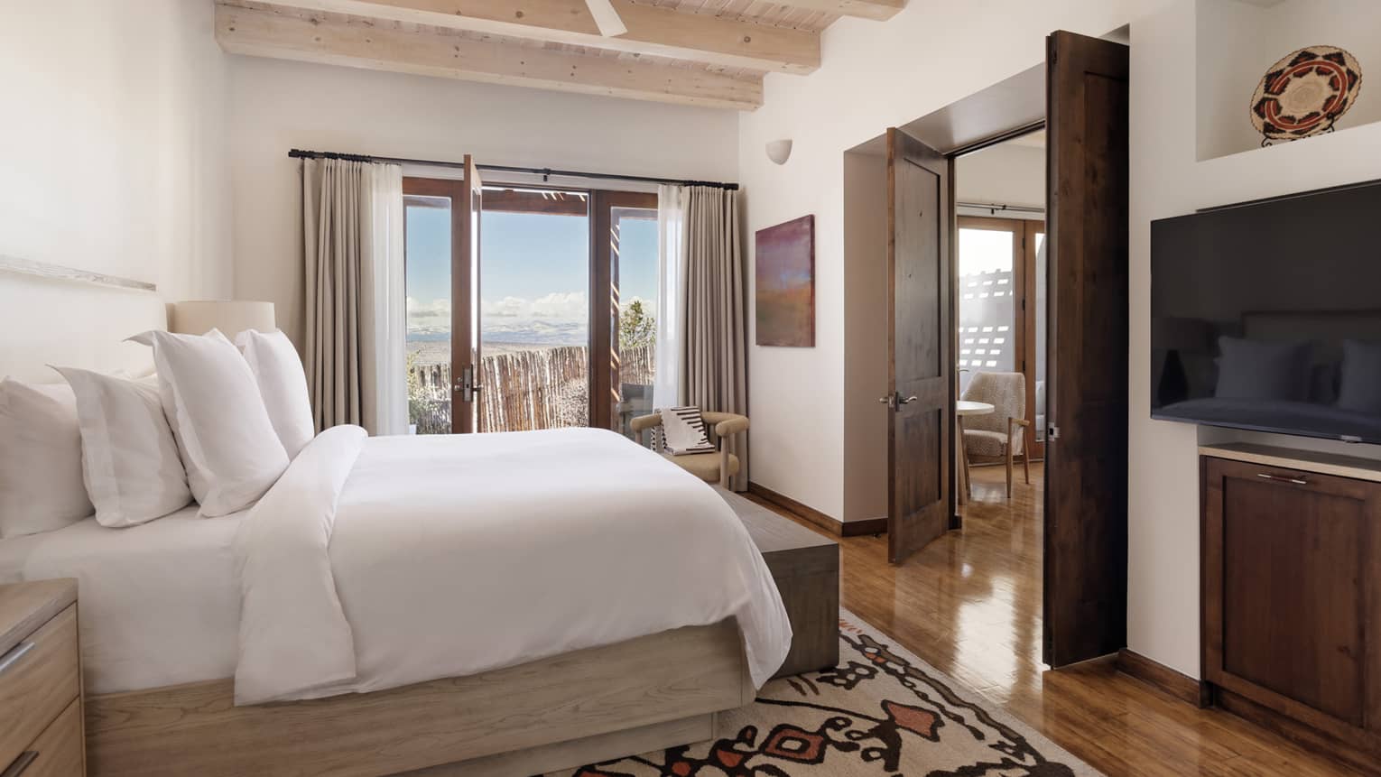 Suite bedroom with king bed at Four Seasons Resort Santa Fe