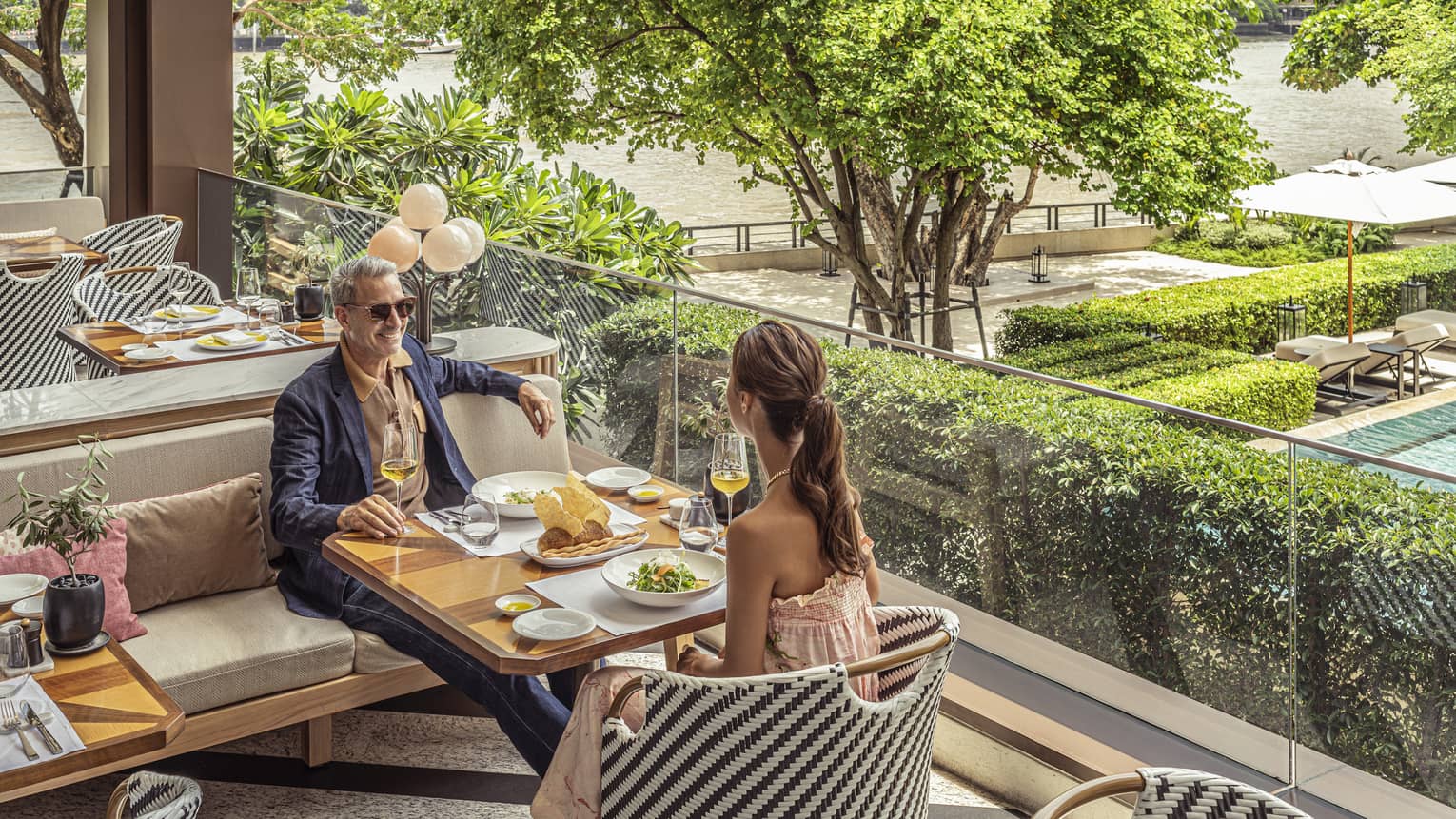 Couple dines on the outdoor terrace at Riva