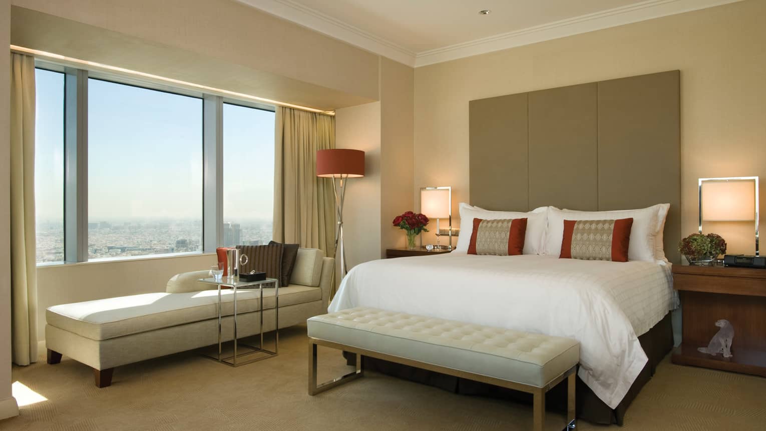 Sunny Executive Suite with brown, beige and ivory decor, long chaise under window