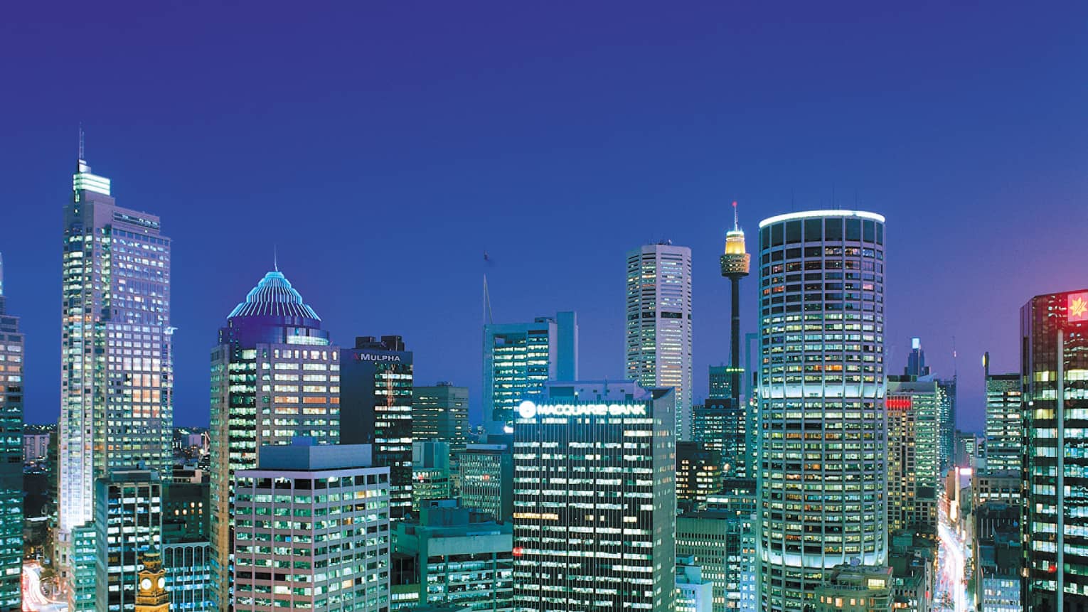 Skyscrapers, lights at night in Sydney's Central Business District