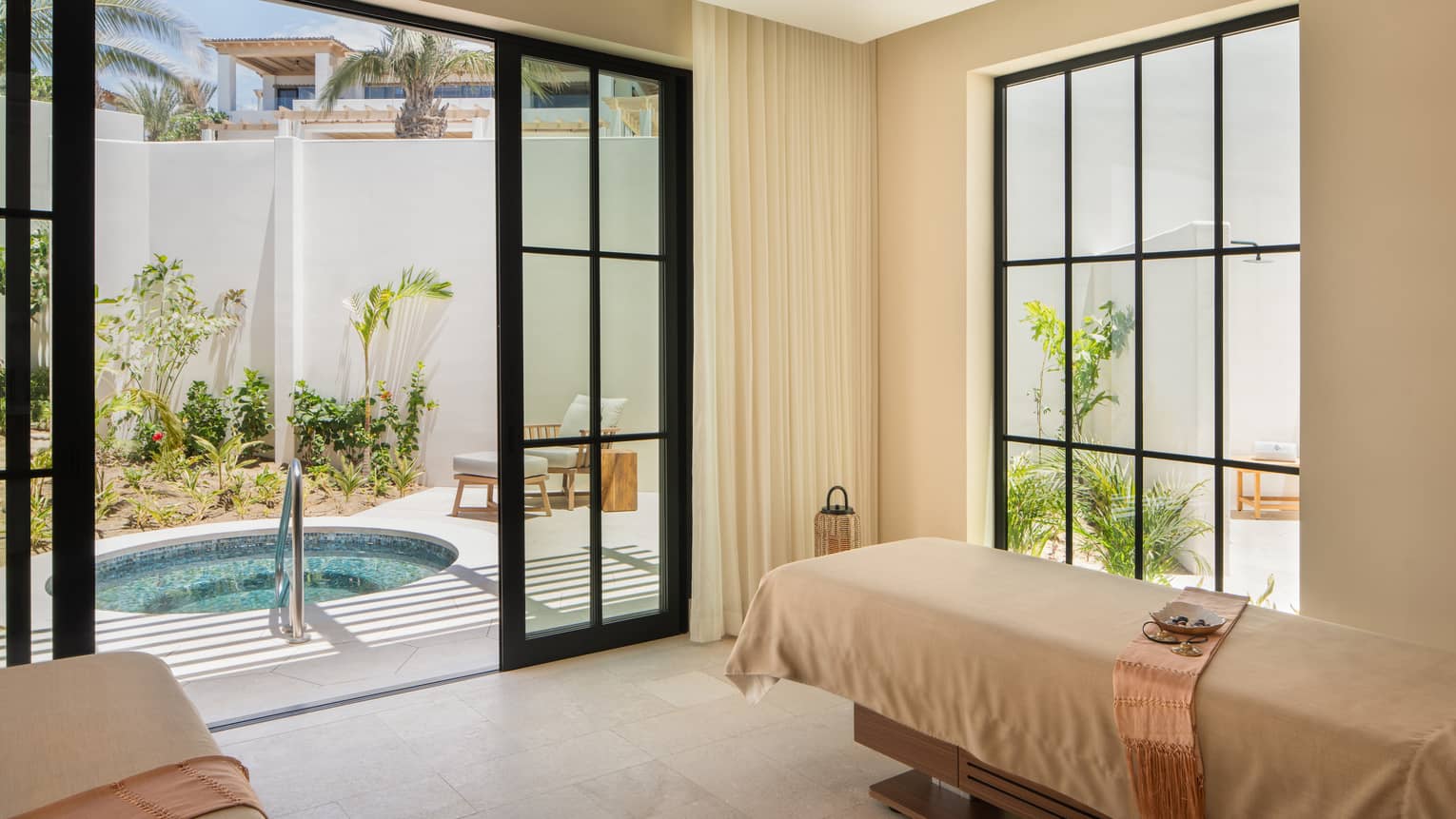 Couples treatment room and walk-out private terrace with plunge pool tub