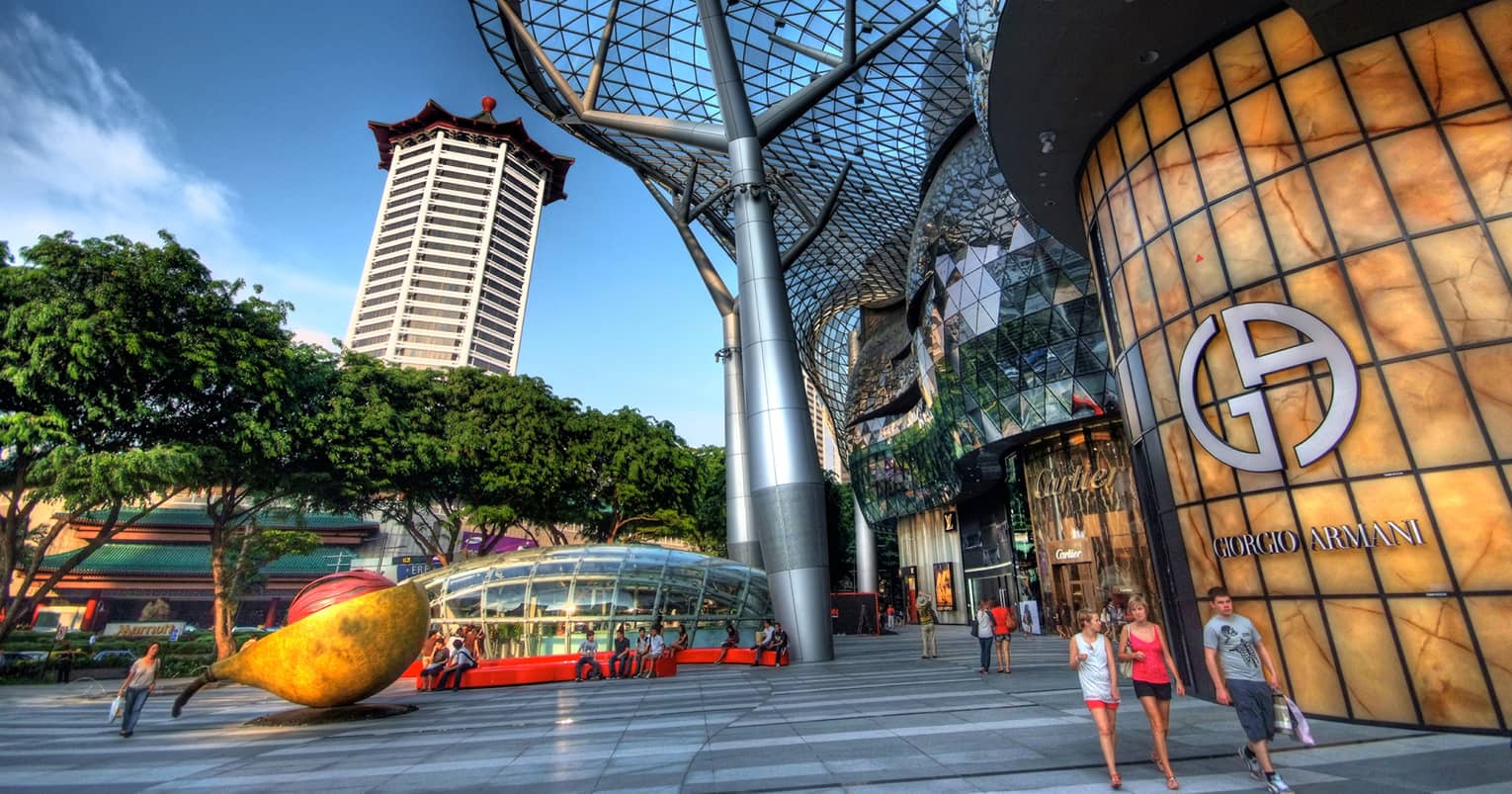 ,People walking outside of a modern shopping mall