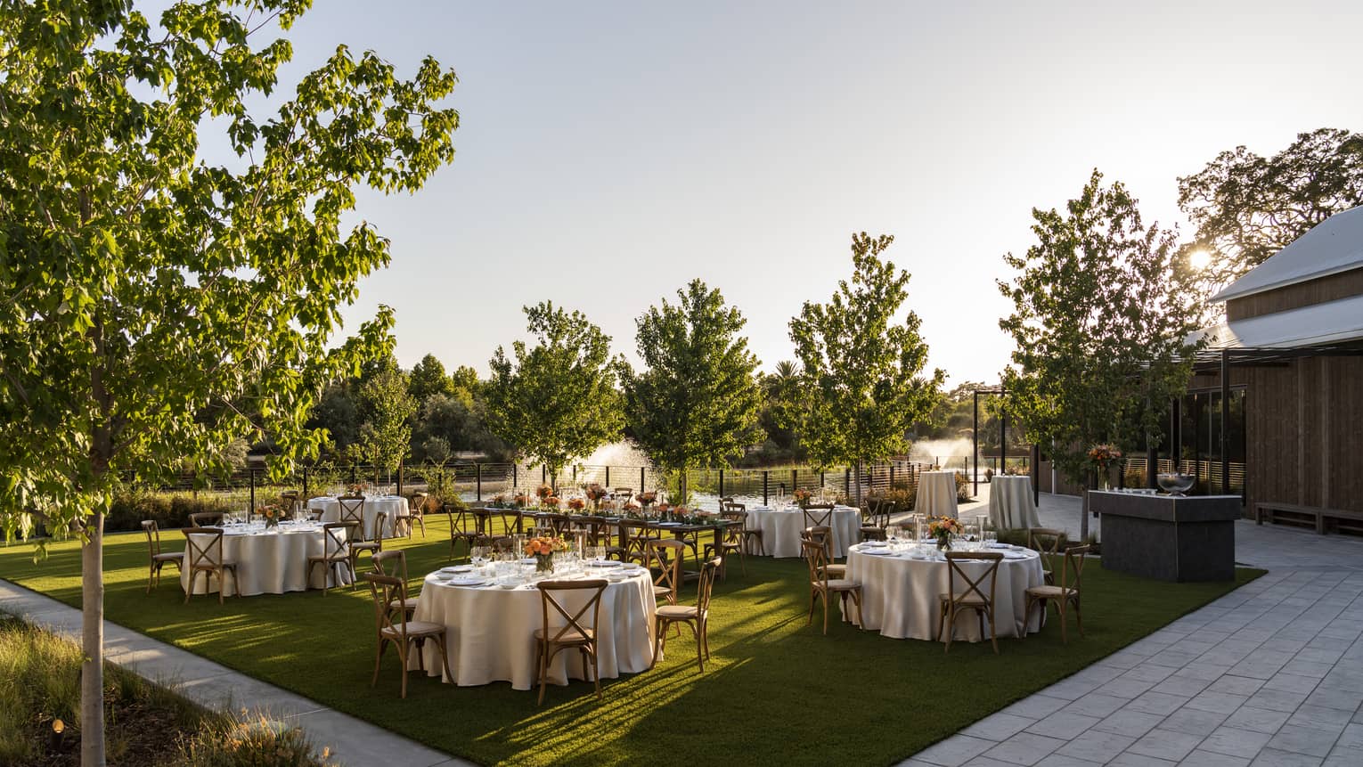 Banquet tables set up in outdoor garden