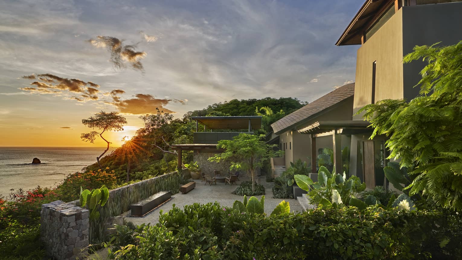 Villa terrace overlooking sea at sunset